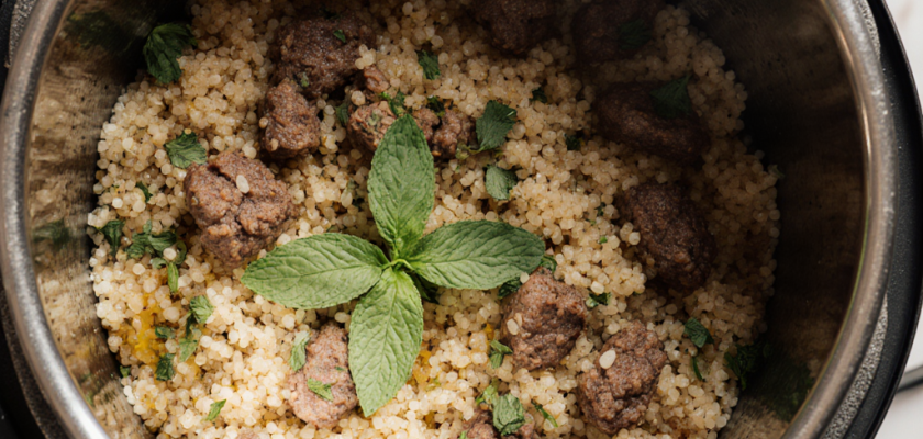 Couscous with browned meatballs and fresh mint in an Instant Pot.